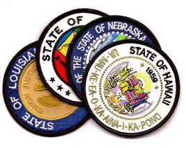 a picture of four state seal flag patches